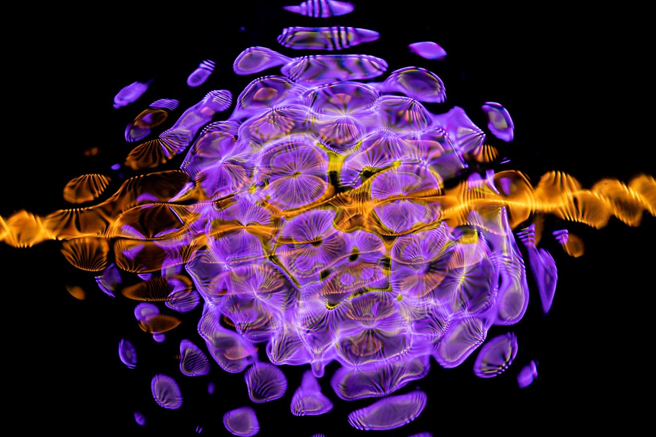 Colorful abstract artwork with vibrant wave patterns in purple and gold tones.