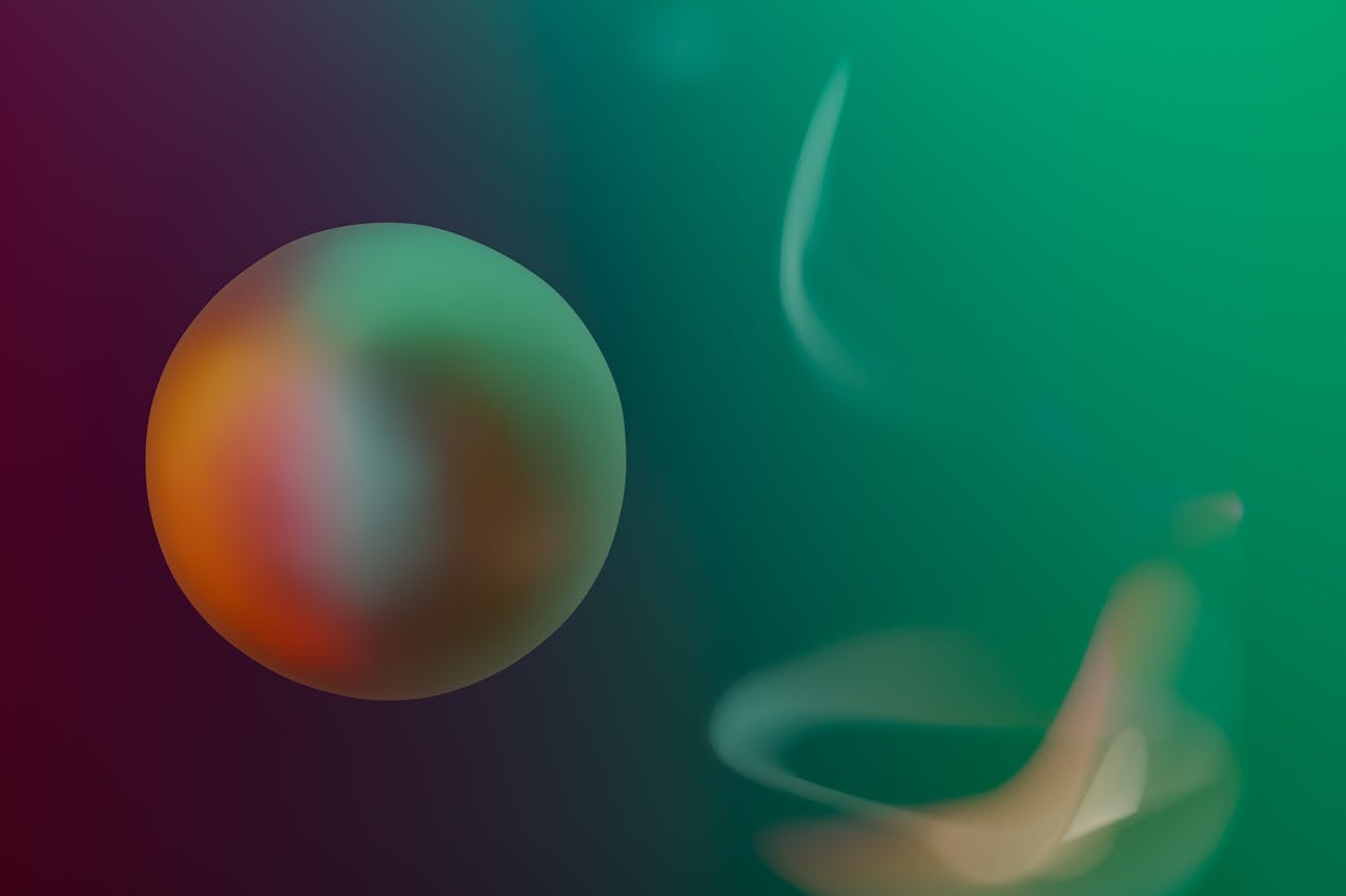 A vibrant abstract image featuring a colorful blurred sphere and wavy patterns.