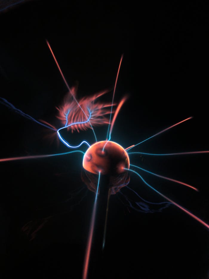 Services A mesmerizing view of a plasma ball emitting colorful electric discharges.